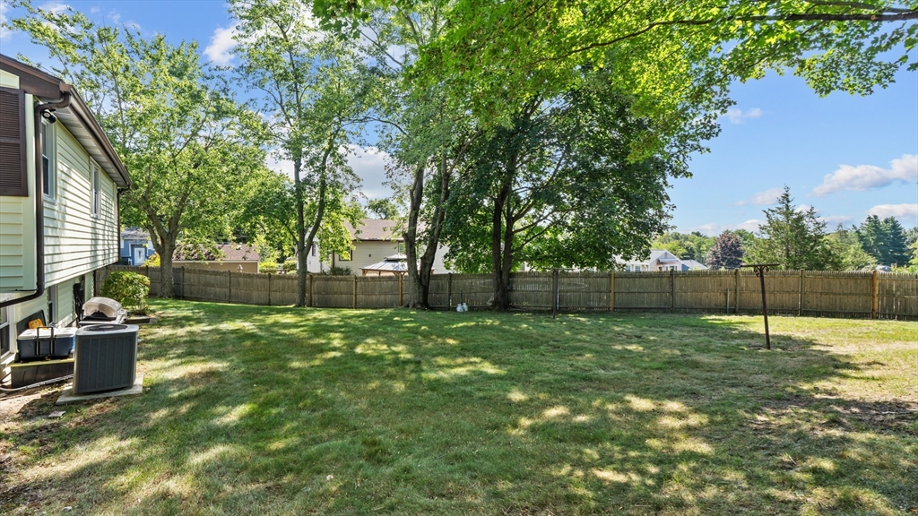 129 Anawan Street Brockton, MA 02302 - Photo 8 of 10 a backyard of a house with lots of green space