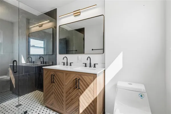 a bathroom with a sink a mirror and a bathtub