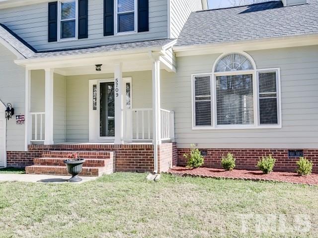 5709 Edgebury Road Raleigh, NC 27613 - Photo 2 of 20 a front view of a house with garden