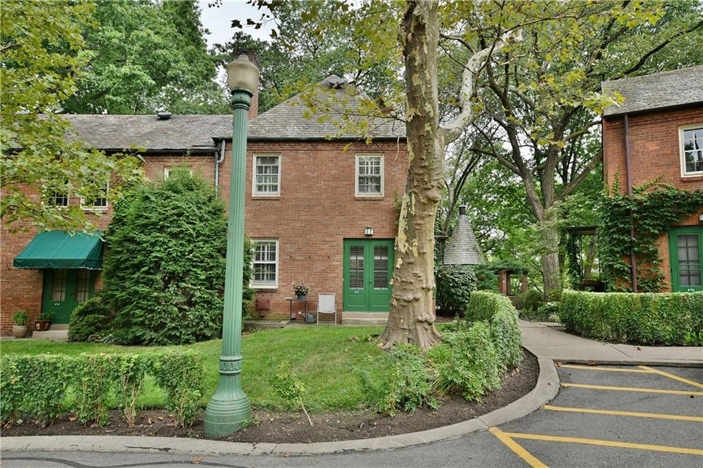 452 Sulgrave Road Pittsburgh, PA 15211 - Photo 1 of 25 a front view of a house with a yard