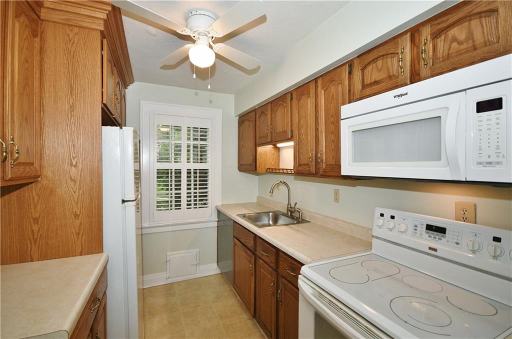 452 Sulgrave Road Pittsburgh, PA 15211 - Photo 11 of 25 a bathroom with a sink a vanity and a mirror