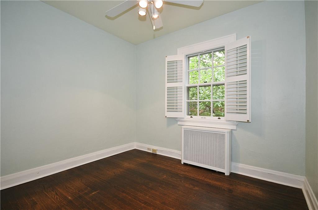 452 Sulgrave Road Pittsburgh, PA 15211 - Photo 16 of 25 an empty room with wooden floor and windows