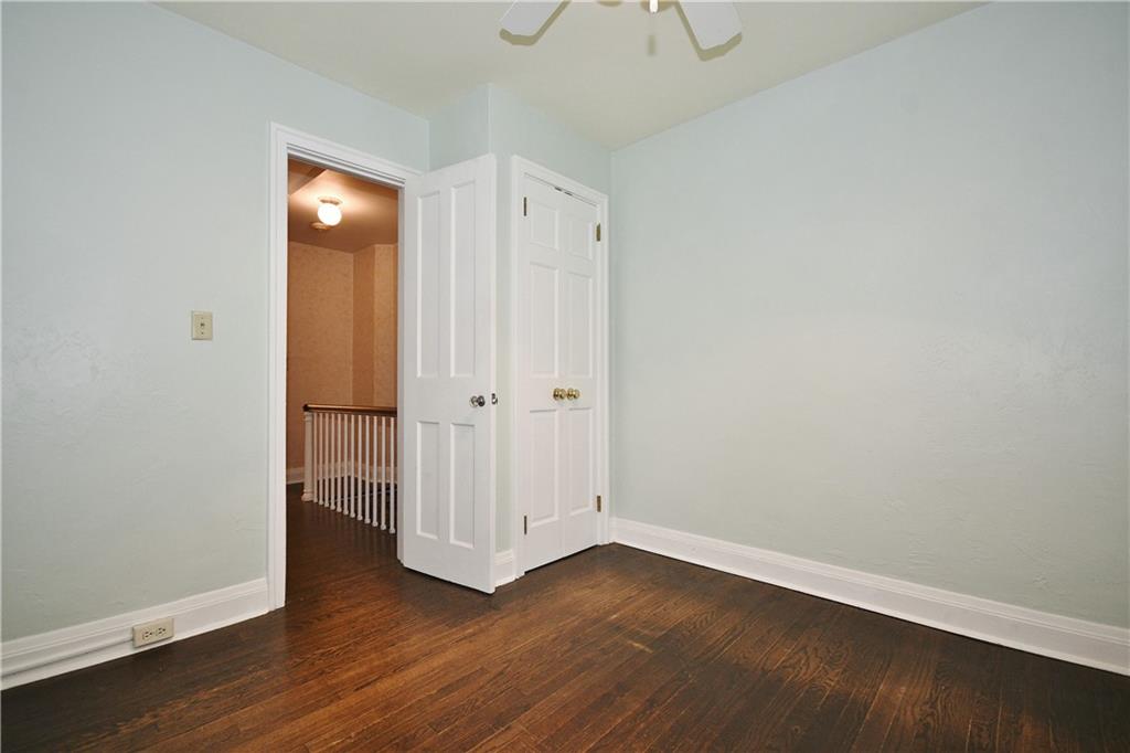 452 Sulgrave Road Pittsburgh, PA 15211 - Photo 20 of 25 a view of an empty room with wooden floor