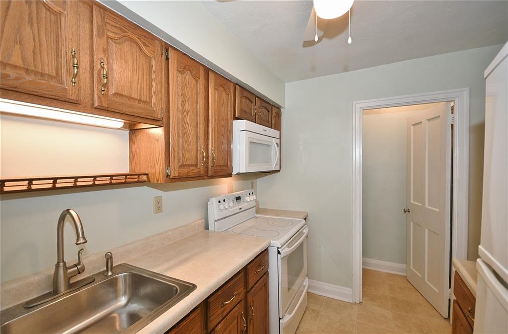 452 Sulgrave Road Pittsburgh, PA 15211 - Photo 10 of 25 a kitchen with a sink and a window