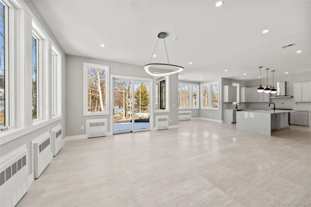 a view of a kitchen with a sink and cabinets