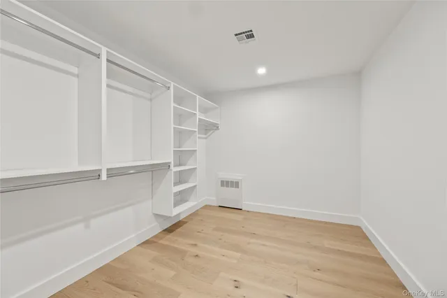 a view of an empty walk in closet