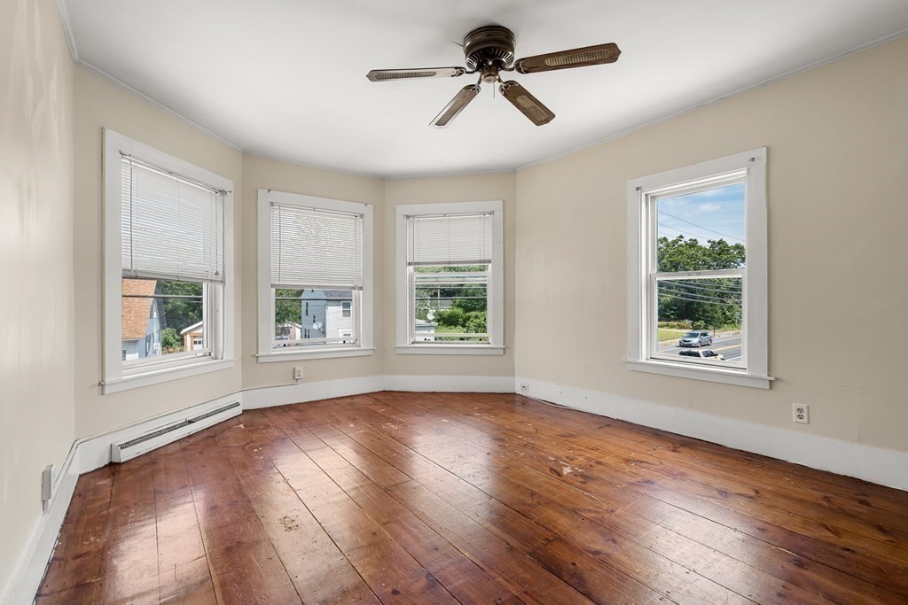 70 Beach Road Salisbury, MA 01952 - Photo 8 of 29 a view of empty room with wooden floor and fan