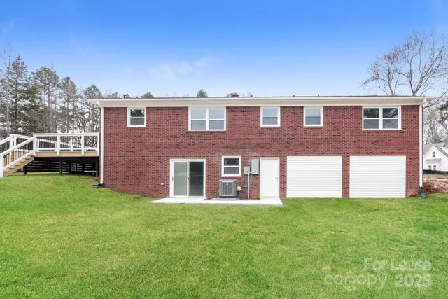 a picture of a wall with a white sign and a white wall
