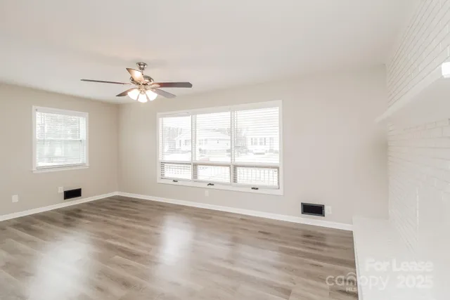 a kitchen with a stove a sink and a refrigerator
