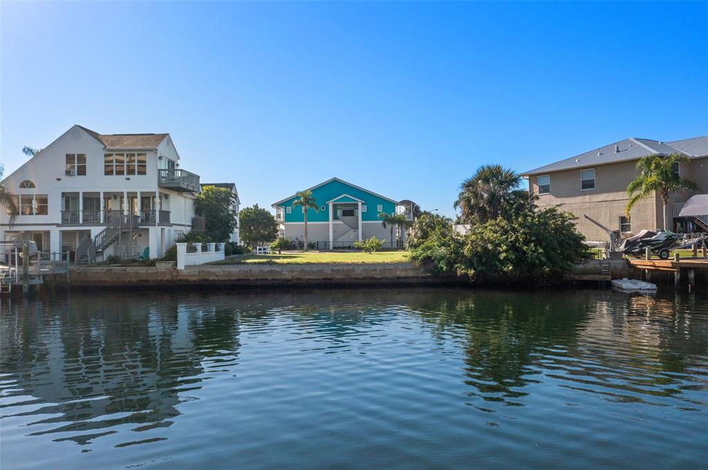5889 Beverly Drive Hudson, FL 34667 - Photo 13 of 16 a view of a lake with houses