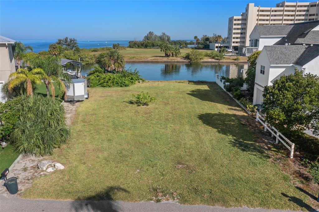5889 Beverly Drive Hudson, FL 34667 - Photo 14 of 16 a view of a lake with a yard