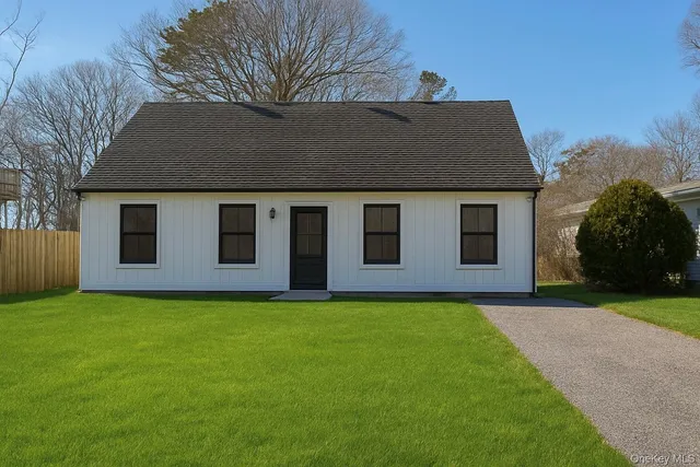 a house that has a big yard in front of it