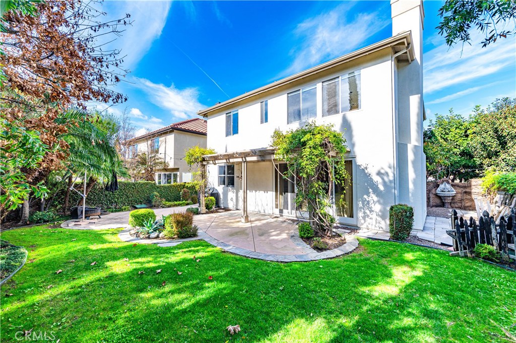 4 Whispering Pine Irvine, CA 92620 - Photo 11 of 13 a view of a chair and table in backyard of the house