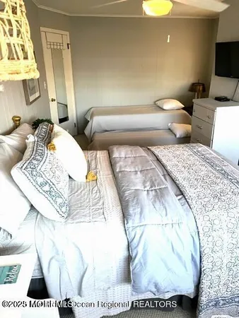 a bedroom with a bunk bed and a dresser
