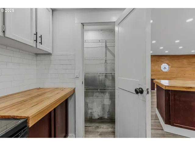 a bathroom with a sink a vanity and a shower