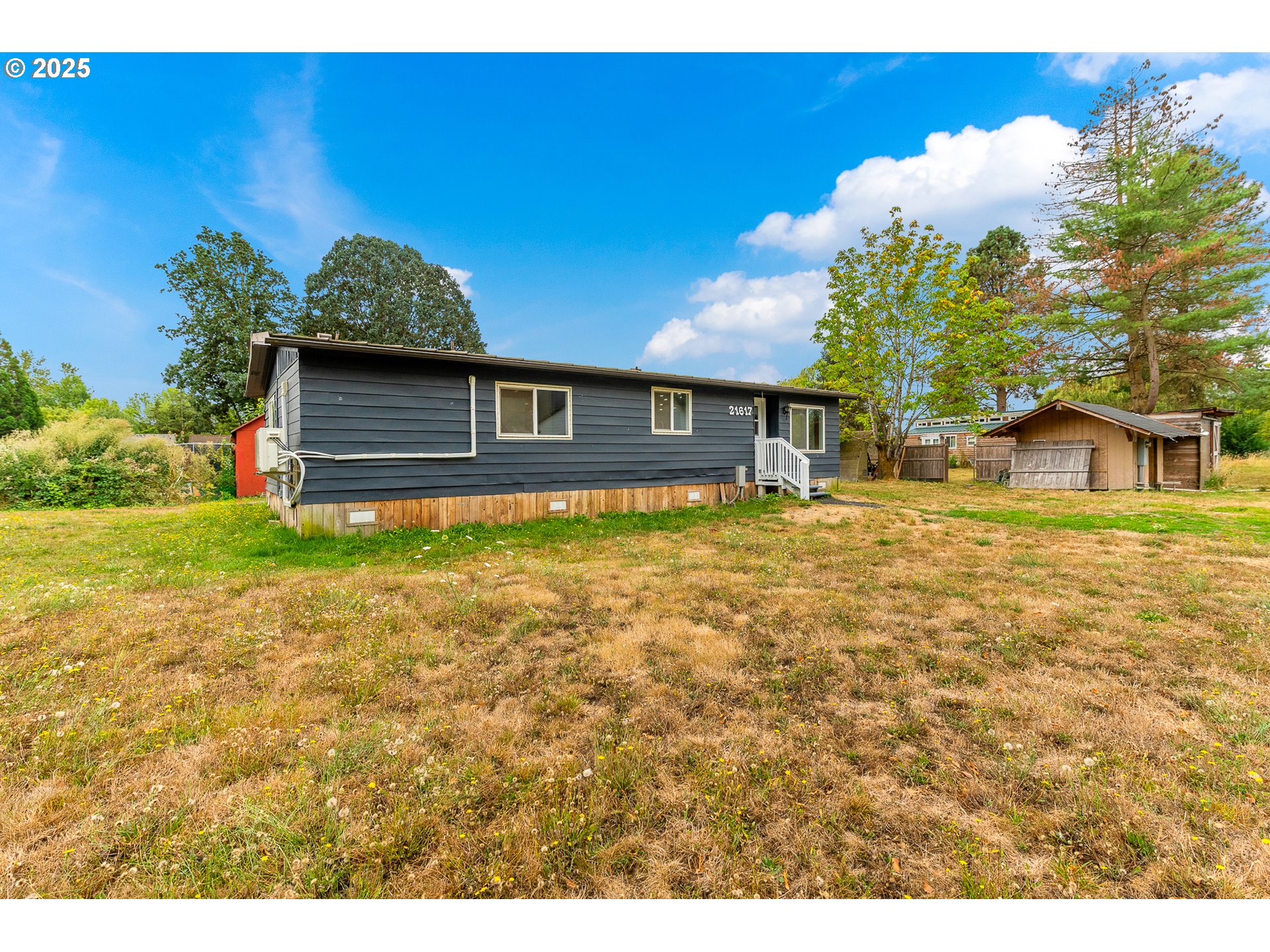 21617 Northeast 15th Avenue Ridgefield, WA 98642 - Photo 2 of 33 a house with garden in front of it