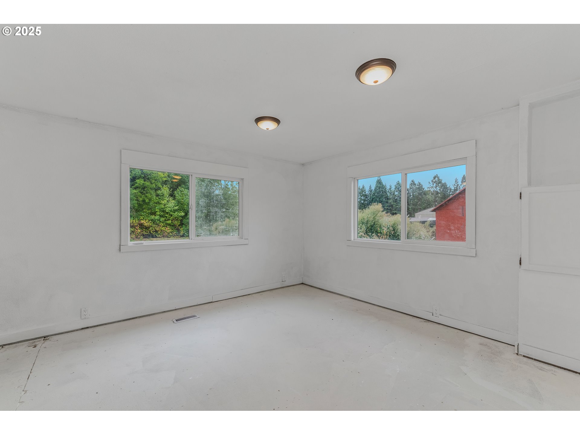 21617 Northeast 15th Avenue Ridgefield, WA 98642 - Photo 21 of 33 a view of an empty room with a window
