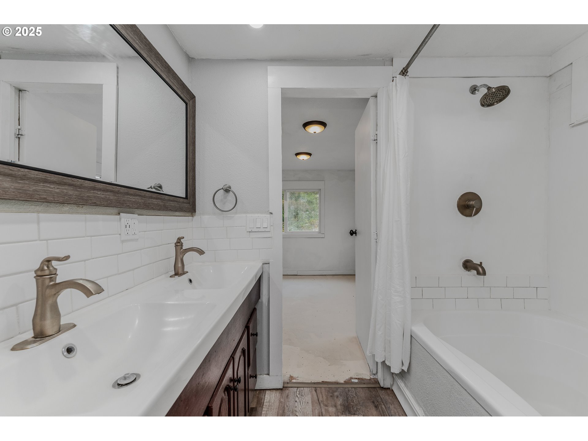 21617 Northeast 15th Avenue Ridgefield, WA 98642 - Photo 27 of 33 a bathroom with a sink a mirror and a shower
