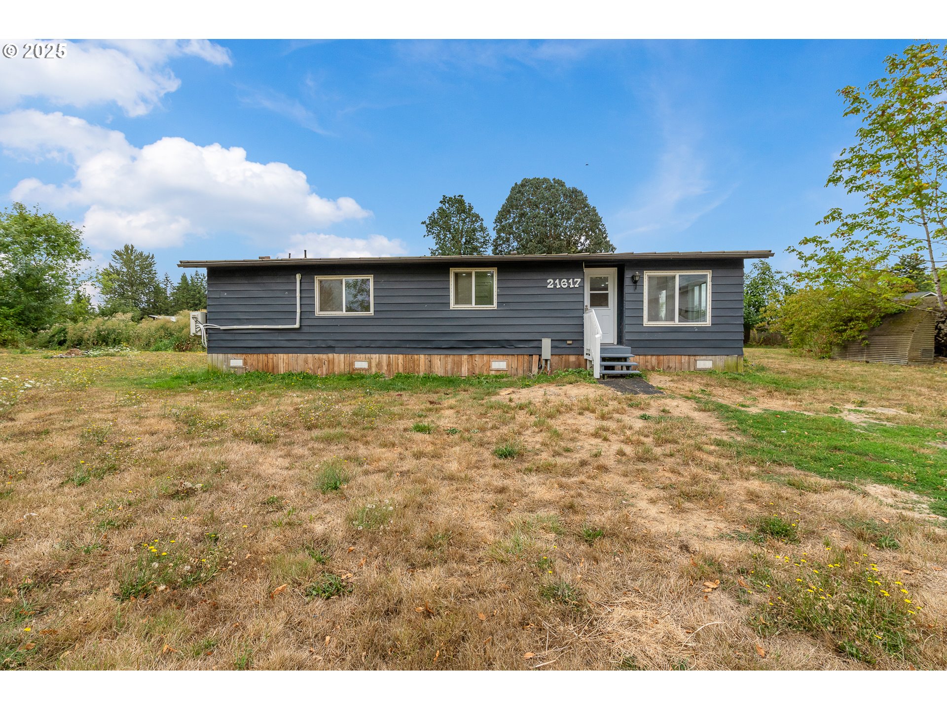 21617 Northeast 15th Avenue Ridgefield, WA 98642 - Photo 3 of 33 a house view with a garden