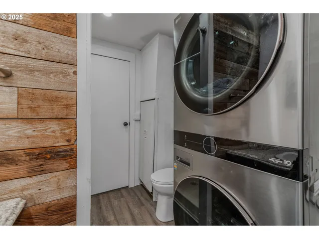 a utility room with sink dryer and washer