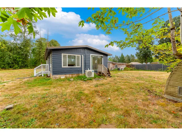 a backyard of a house with lots of green space