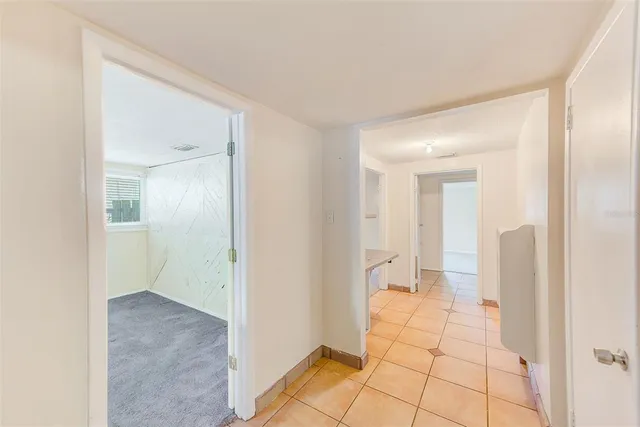 a utility room with cabinets washer and dryer