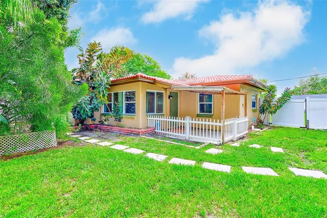 a view of backyard with green space