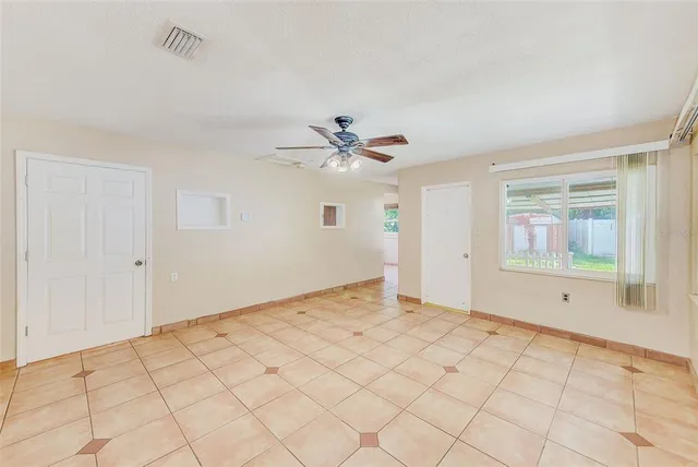 a view of an empty room and window