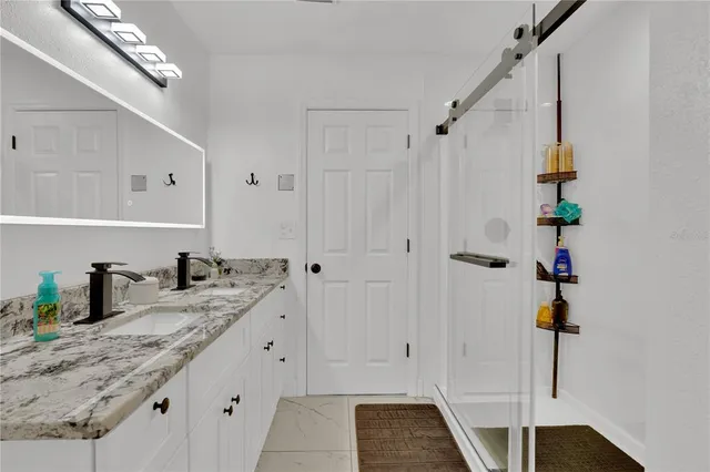 a bedroom with a bed and a desk