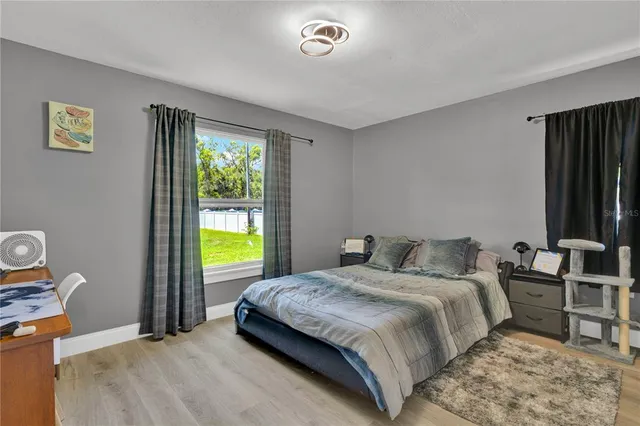 a view of porch with wooden floor