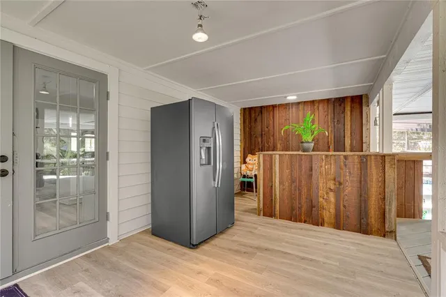 a view of a backyard with a patio and plants