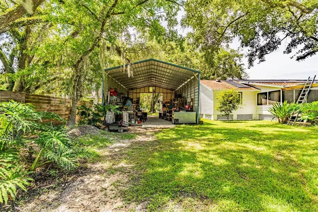 a view of houses with yard