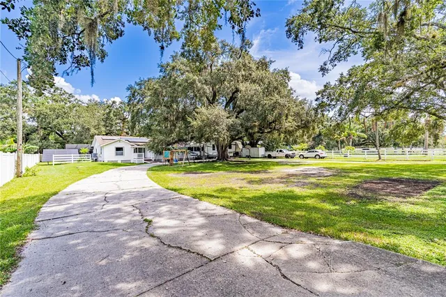 a view of a backyard with a small house