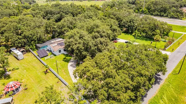 a view of a yard with swimming pool