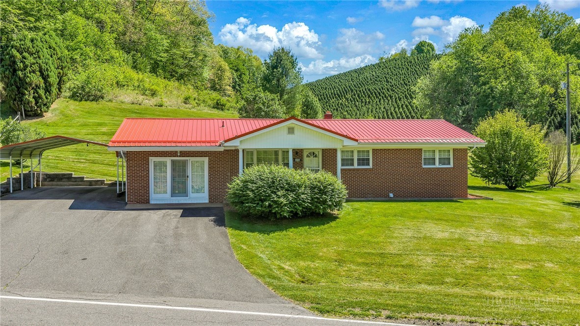 346 Piney Creek Road Lansing, NC 28643 - Photo 1 of 24 a view of a house with a yard
