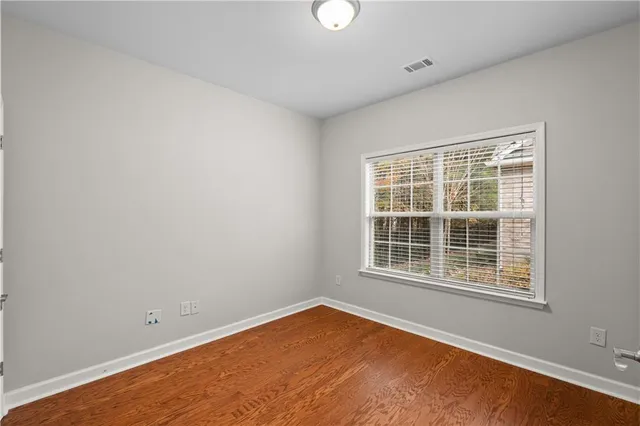 a bathroom with a sink toilet and a mirror