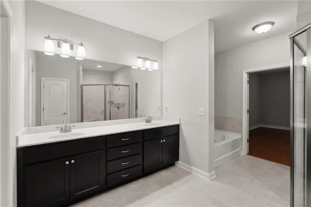 a bathroom with a bathtub and shower