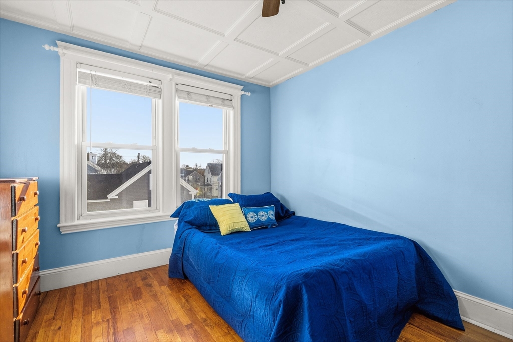 4 Elm Street, Unit 3 Peabody, MA 01960 - Photo 19 of 24 a bedroom with a bed and window