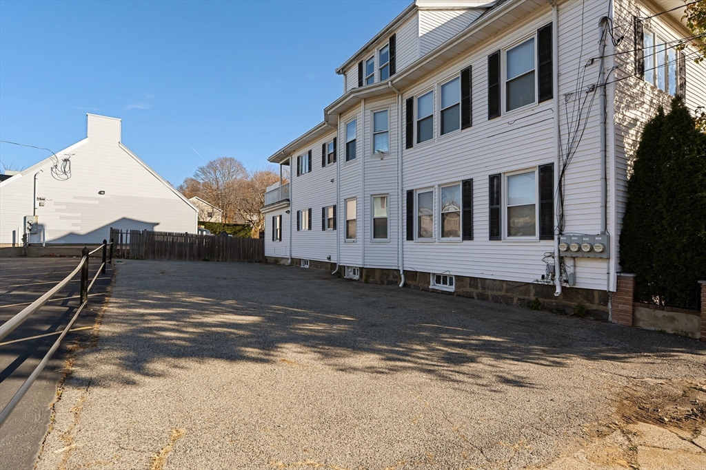 4 Elm Street, Unit 3 Peabody, MA 01960 - Photo 24 of 24 a view of a white house with a yard