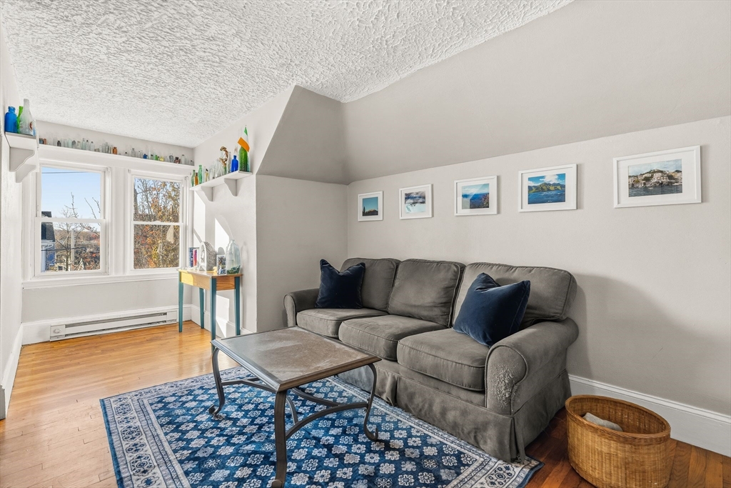 4 Elm Street, Unit 3 Peabody, MA 01960 - Photo 4 of 24 a living room with furniture and a window