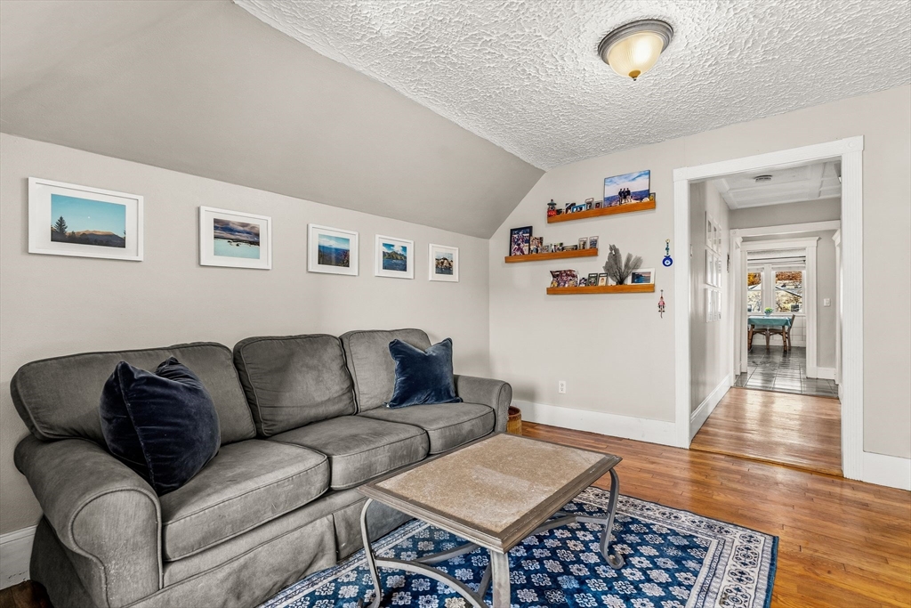 4 Elm Street, Unit 3 Peabody, MA 01960 - Photo 7 of 24 a living room with furniture and a wooden floor