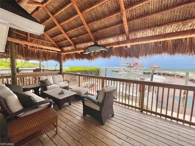 a view of balcony with furniture