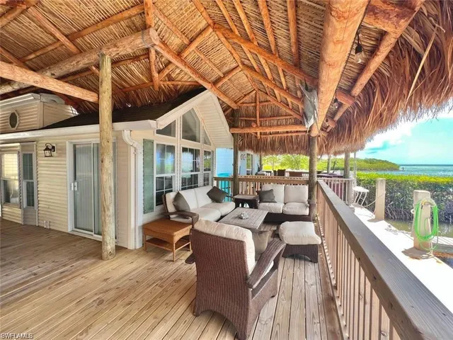 a view of balcony with couch and wooden floor