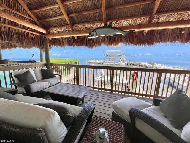 a view of a balcony with furniture