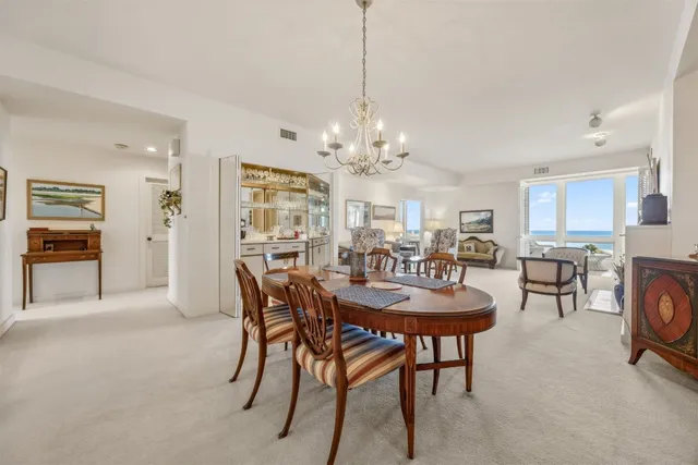 a bedroom with a large bed and a dresser