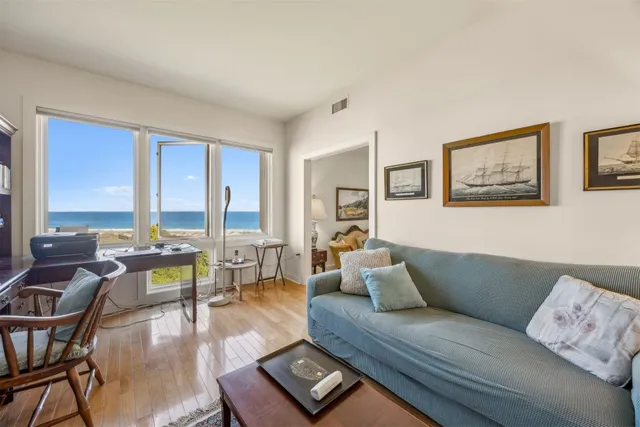 a front view of a house with a yard and porch