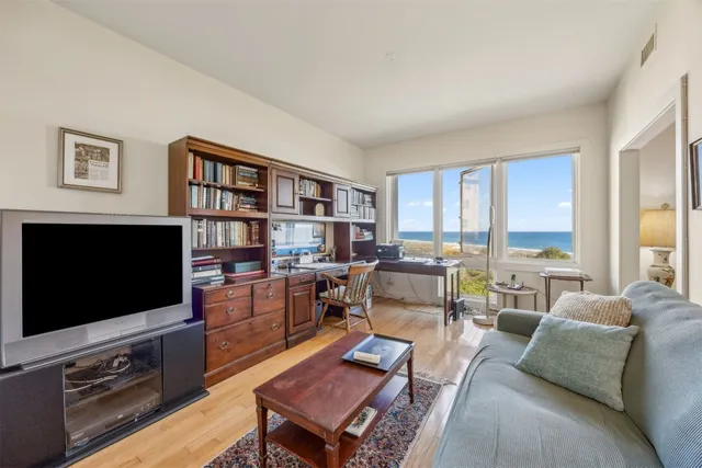 a sign that is in front of flowers