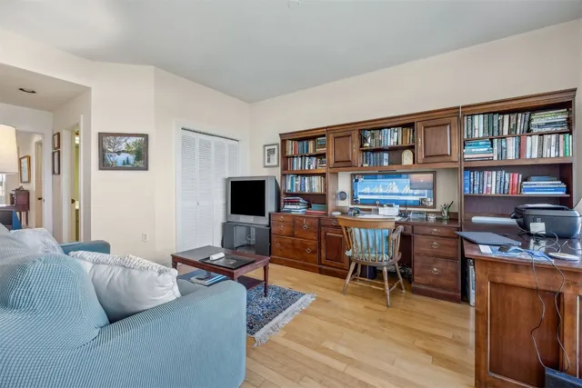 a view of a yard with plants and trees