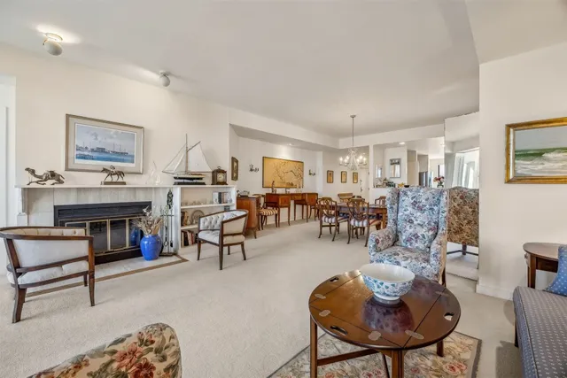 a living room with furniture flat screen tv and a fireplace