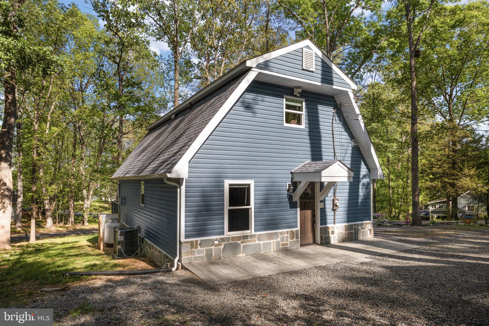 151 Harrison Circle Locust Grove, VA 22508 - Photo 4 of 83 a view of a house with a yard and tree s